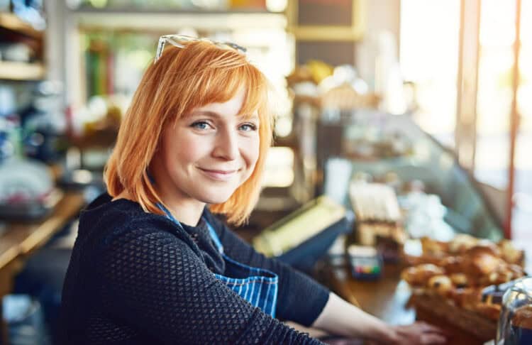 Portrait of a confident young woman woman working in a coffee shop